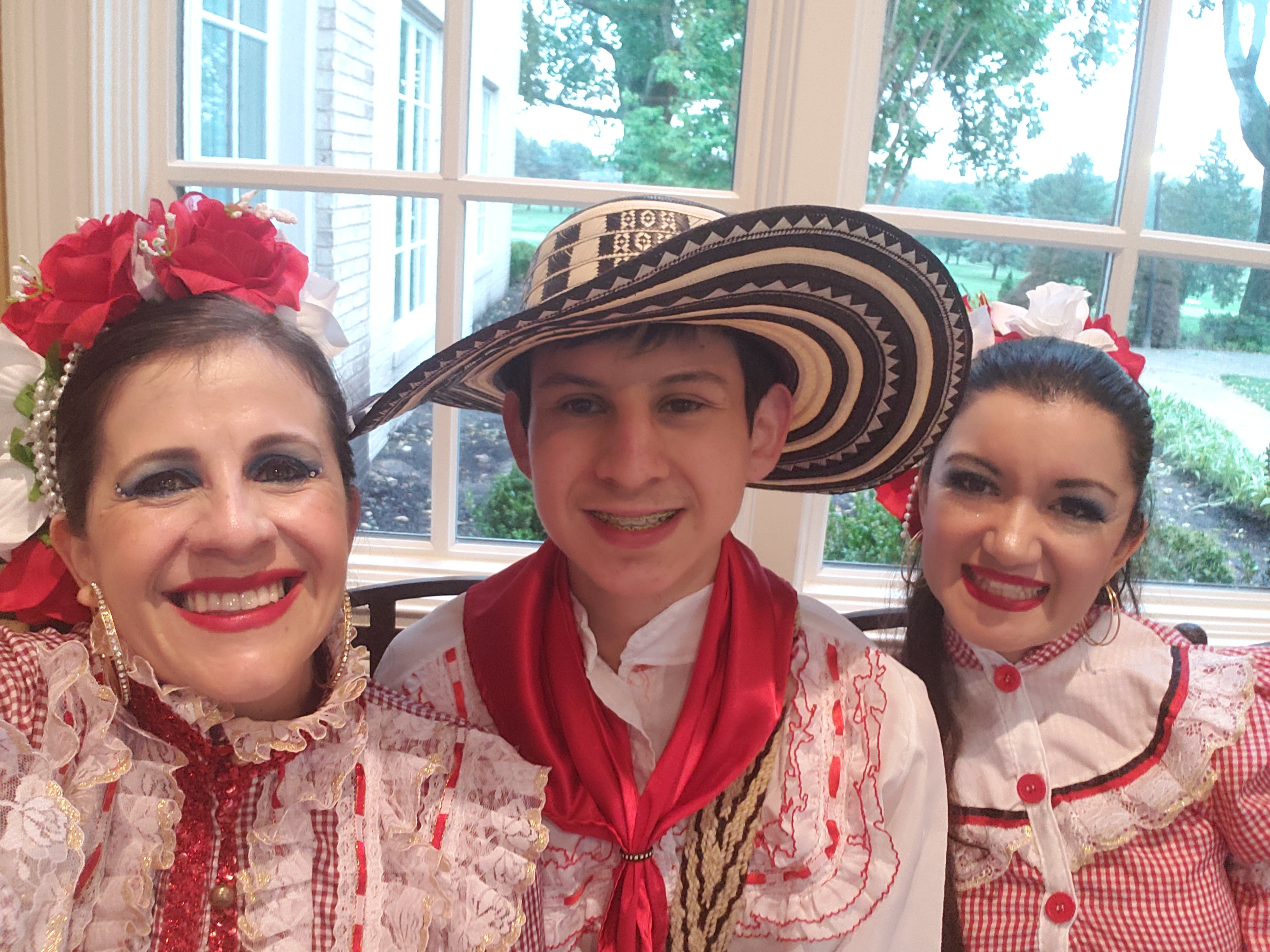 Dance teacher Lola and son Gusti in traditional Colombian dresses